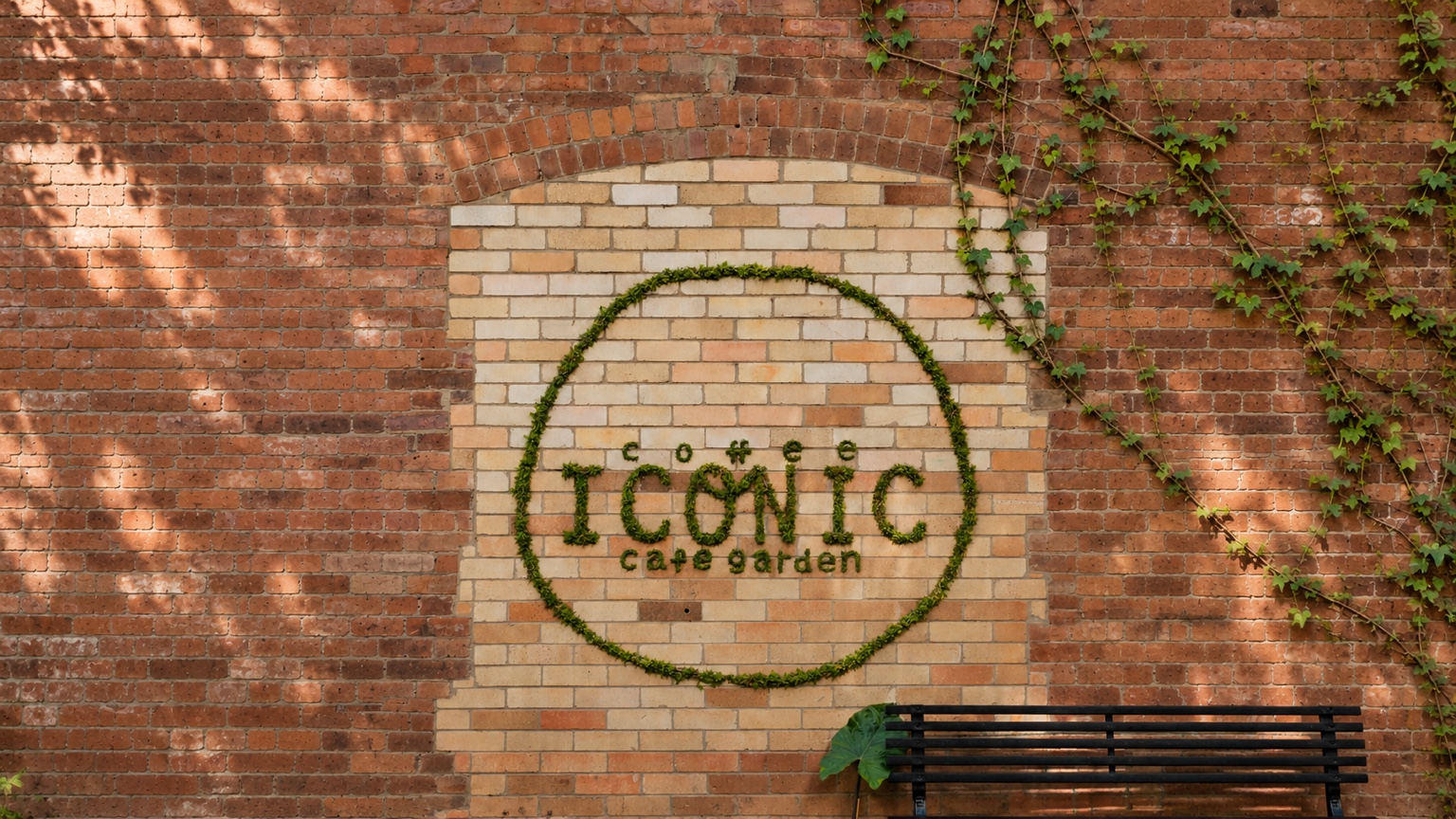 Coffee Iconic's leafy sign set into a warm brick wall